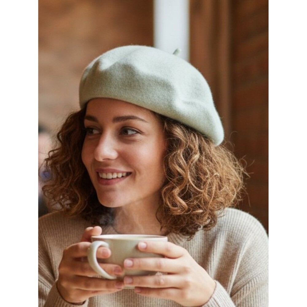 Classic French beret silhouette in soft cream with a subtle mint undertone